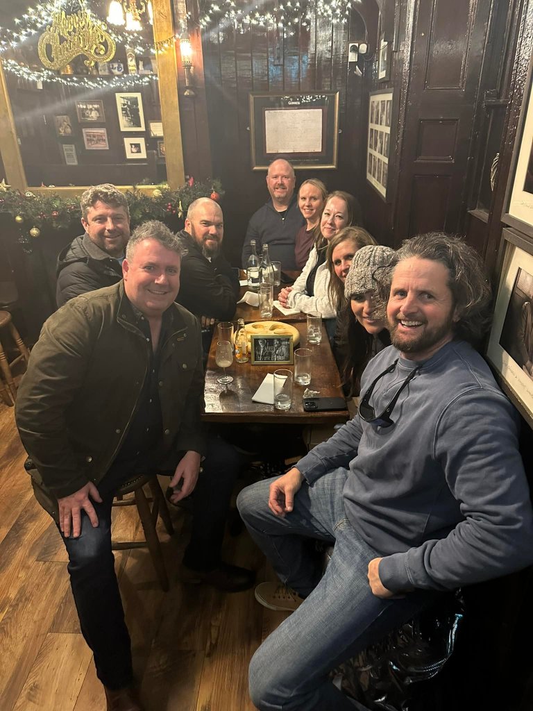 Food tour group enjoying a drink with Anthony