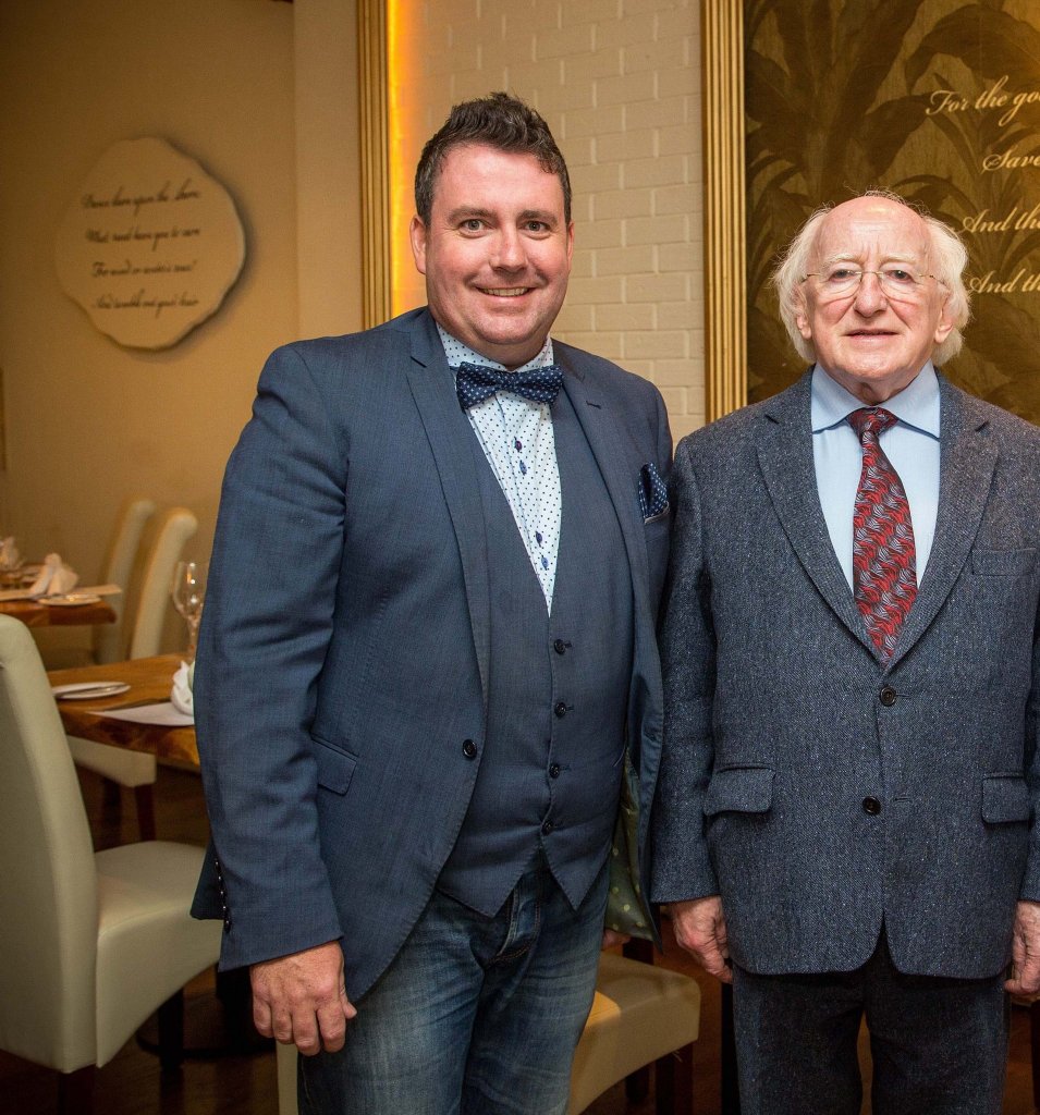 Anthony Grey standing with the president of Ireland